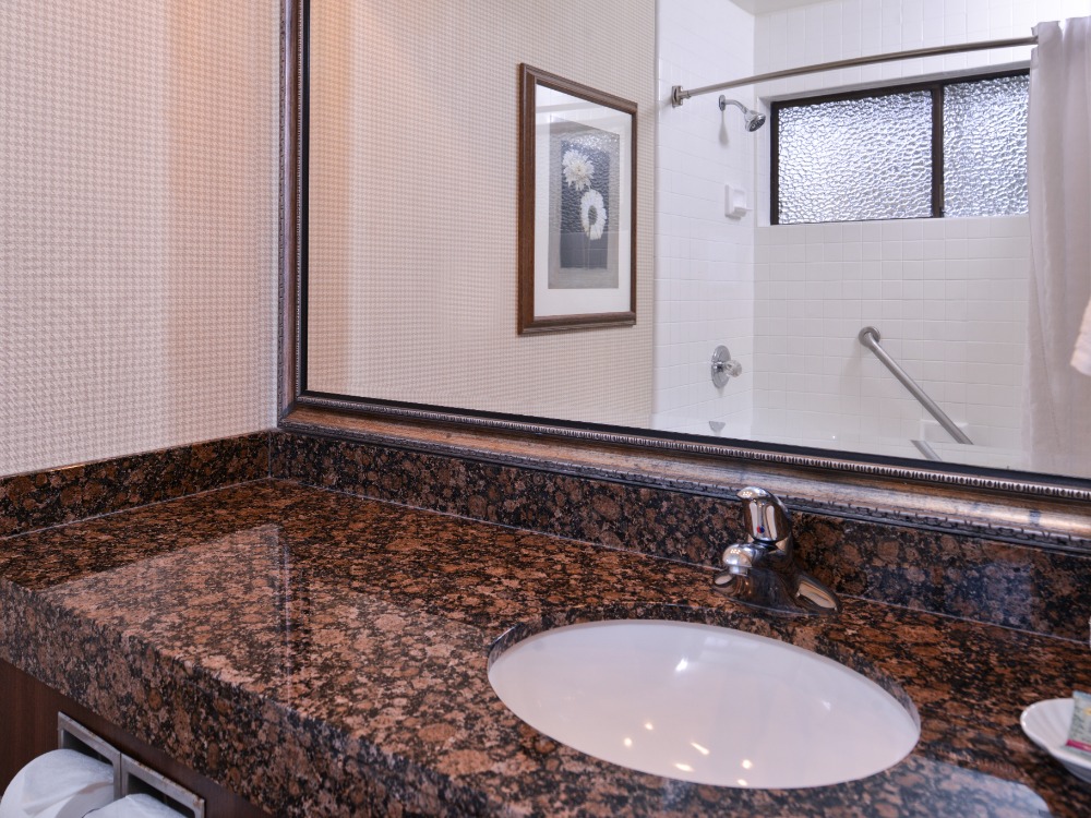 Hotel bathroom sink and mirror