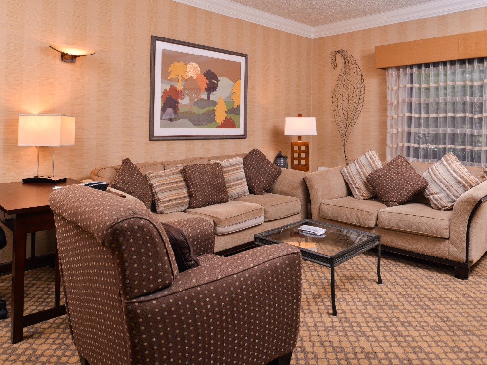 Hotel living room area with couches and chairs